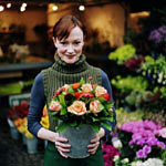 Image of woman holding a flower pot