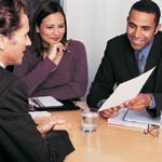 Image of two men and a woman working