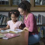 Image of mother and child reading