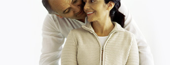 Photograph of hugging couple.