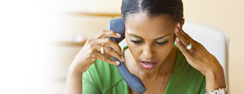 Photograph of woman on telephone.