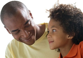 Image of man and boy smiling