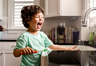 child brushing teeth
