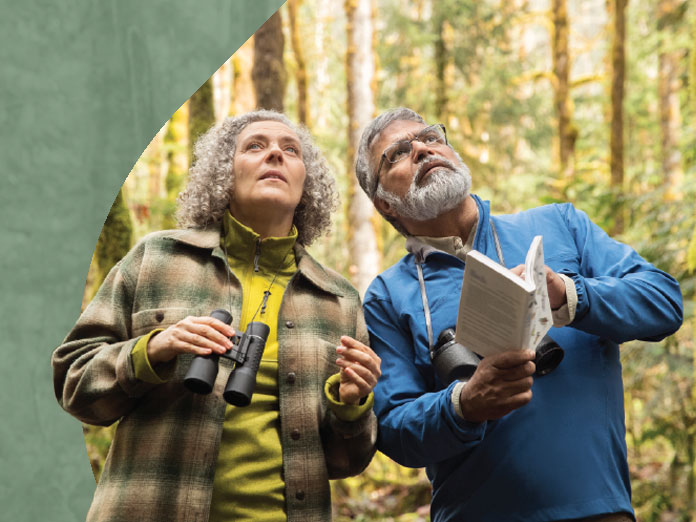 Two people on a hike, who are both eligible for medicare