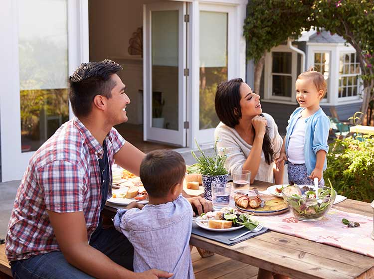 Family eating dinner outside