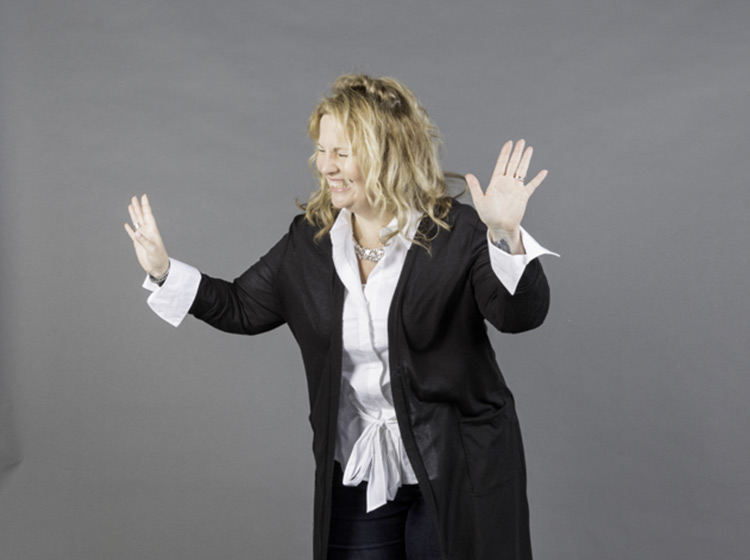 Shara laughing in a studio setting