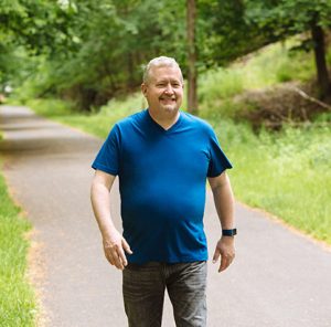 Larry walking in his neighborhood