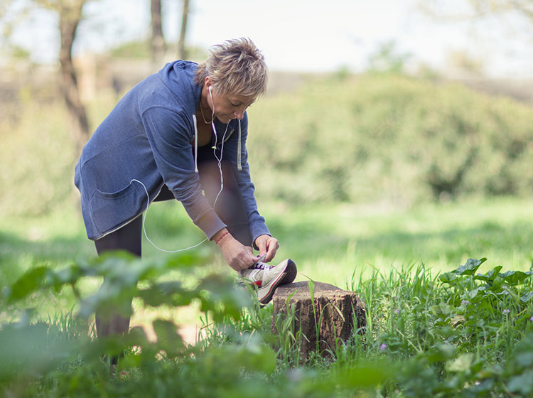woman tying sneakers