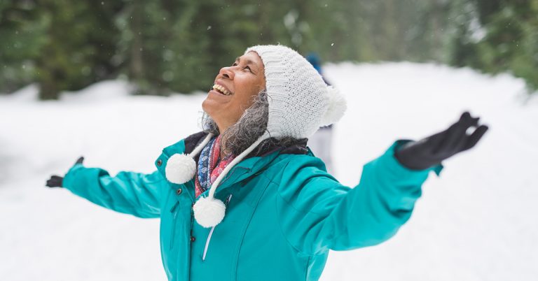 woman smiling in snow