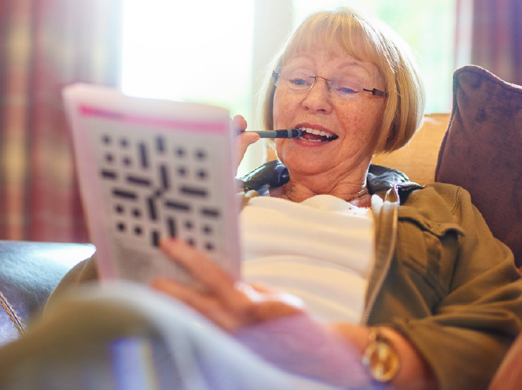 Woman doing crossword puzzle