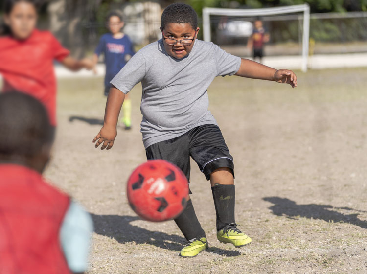 boy playing soccer Twitter