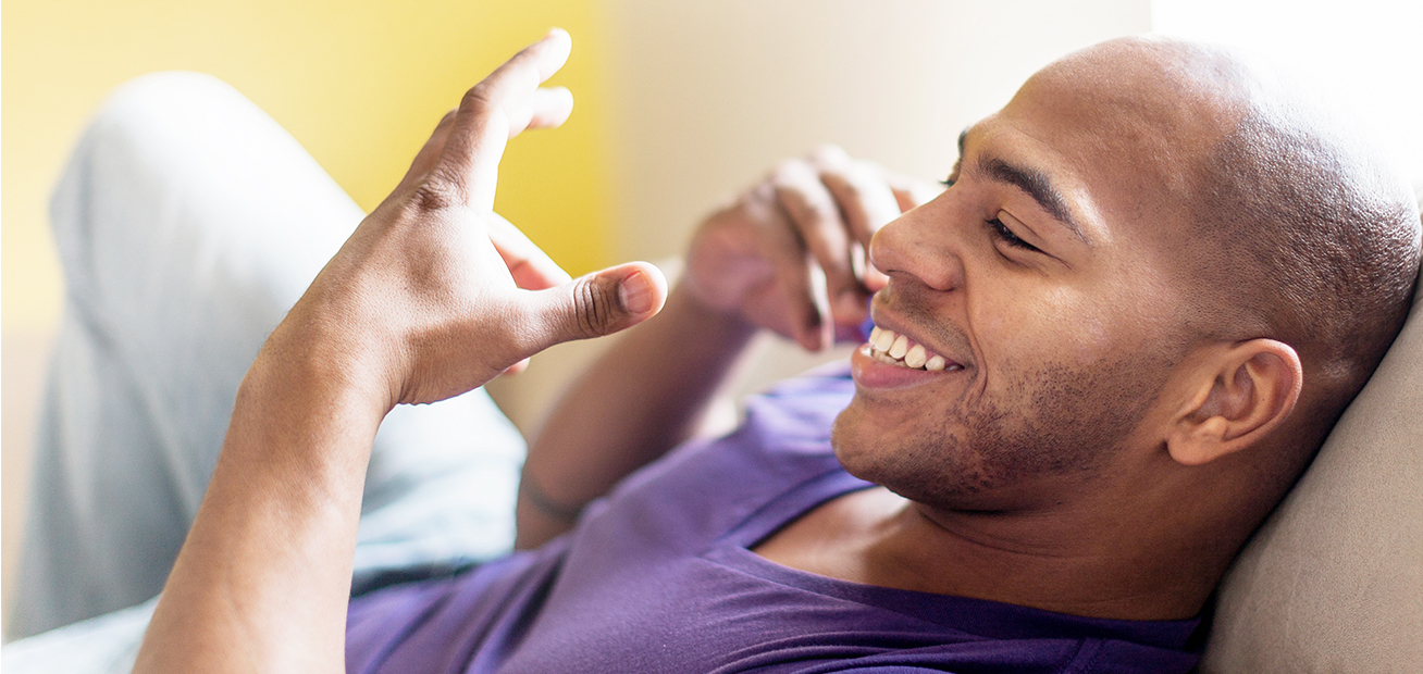 Young man smiling while talking on the phone
